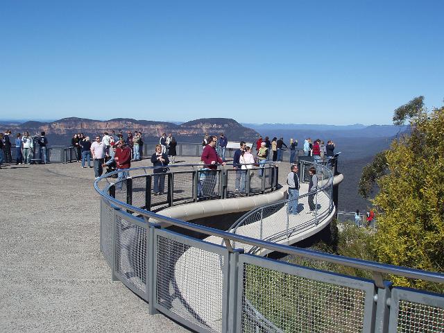 visitors to the blue mountain national park enjoing the view from the echo point lookout