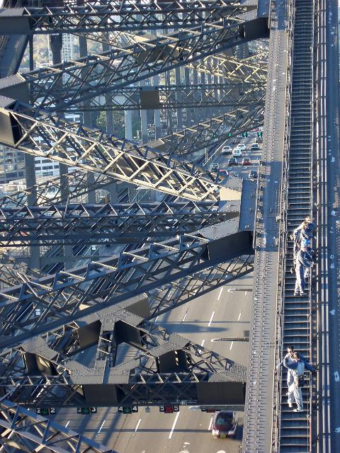pausing to look at the view while climing the steps to the top of sydneys famous harbour bridge