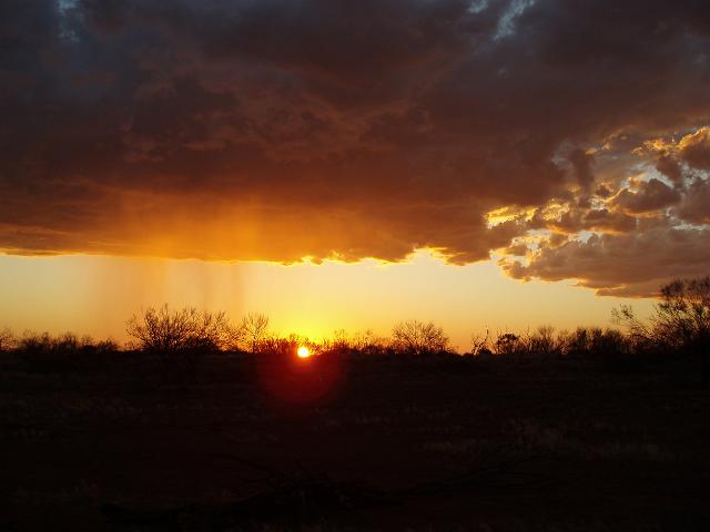 sun setting over desert scrubland near kings creek station
