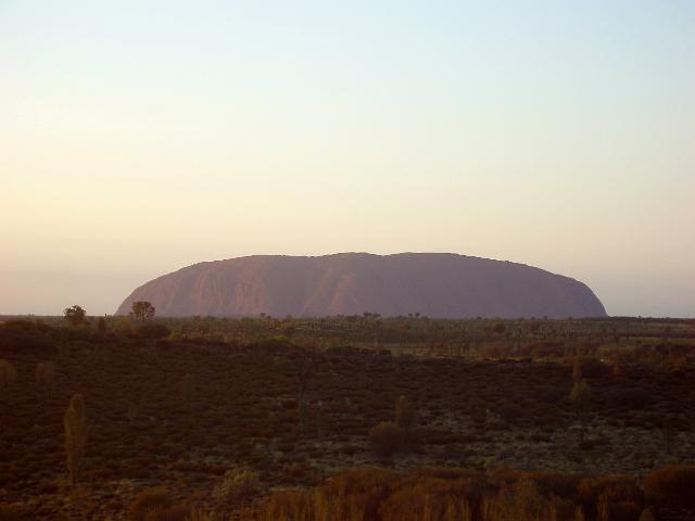 a classic view of the break of a new day over uluru, ayres rock