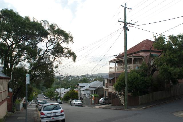 Suburban Brisbane showing a typical street scene with residential houses and parked cars