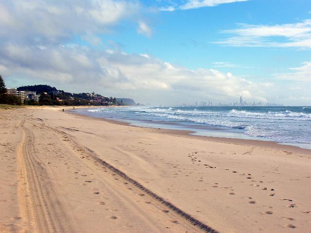 miles of sand at coolangatta beach, high-rise towers of surfers paradise gold coast in the background