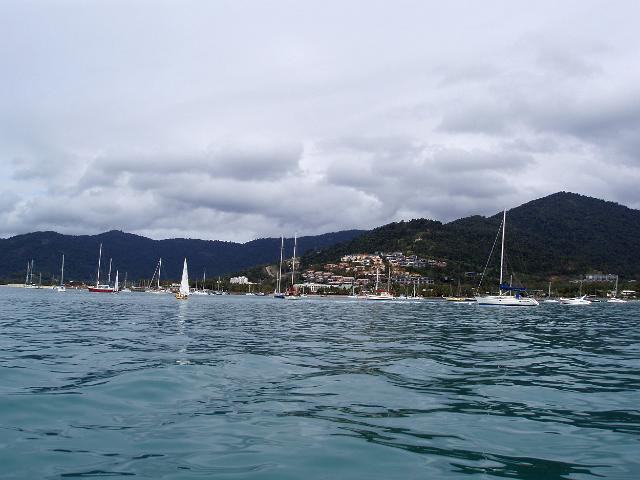 a sailing dingy among yachts moored at airlie beach, north queensland