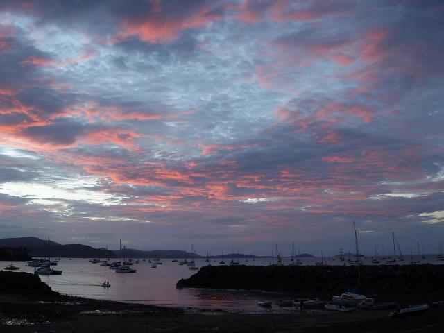 sunset over the pond and boats at the front of the whitsunday sailing club