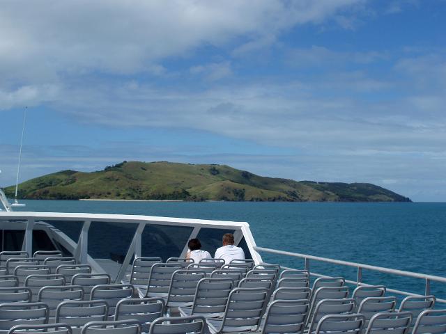 an almost empty ferry upper deck with dent island in the background