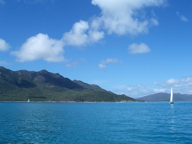 a yacht sailing of the coast of gloucester island, queensland