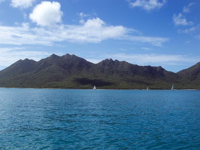 a view of gloucester island and sailing boats on the tropical queensland waters