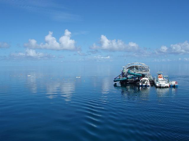 a calm sunny day out at the barrier reef, knuckle reef pontoon