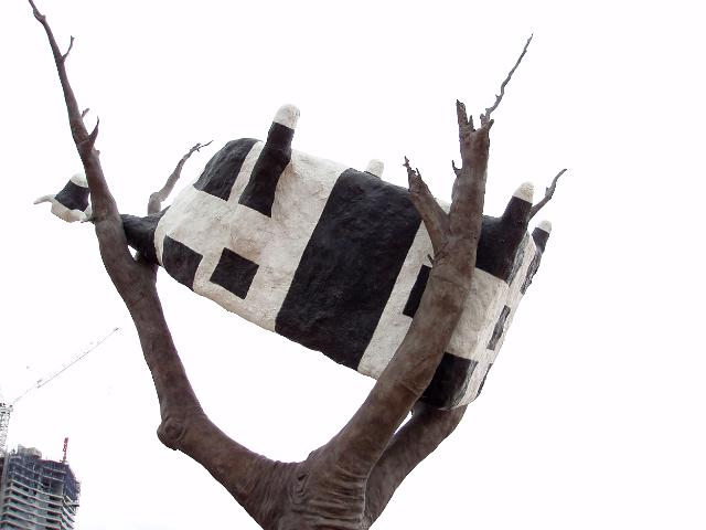 cow up a tree, a sculpture in melbournes docklands
