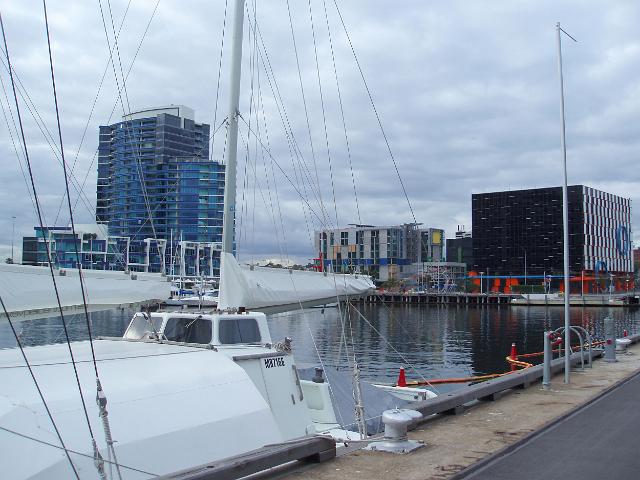 a yacht moored on a wharf in melbournes dockland