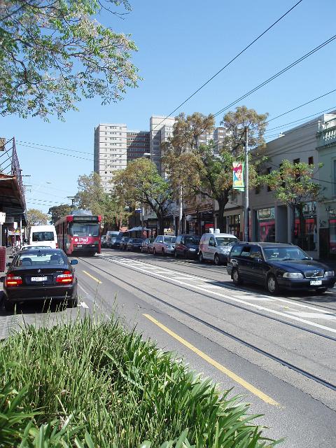 gertrude street scene, passing cars and a melbourne tram