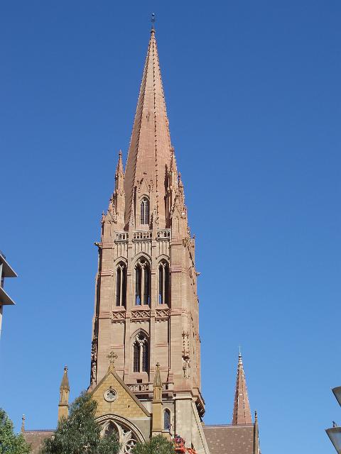 the tower and spire of st pauls cathedral melbourne