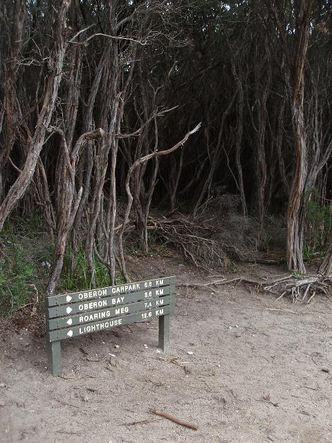 a sign marking distances along a footpath on wilsons promontory