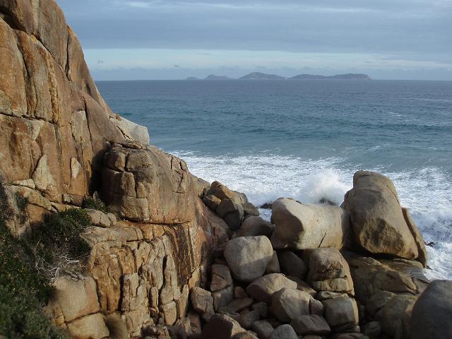 rocky coastline of wilsons promontory looking out to sea towards the glennie island group
