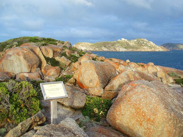 a small wooden sign at south point marking australias most southerly mainland place