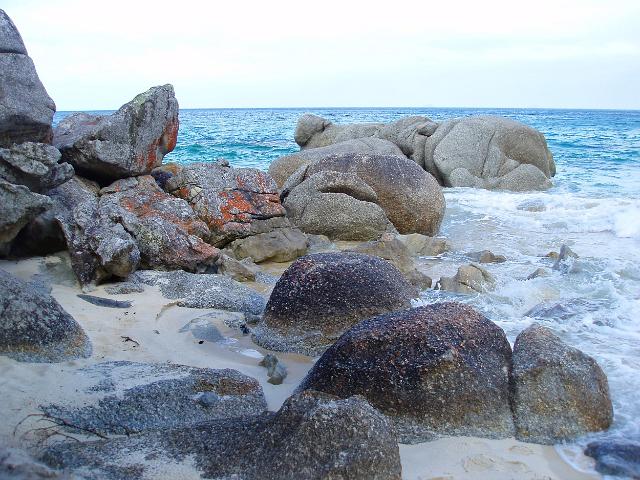 waves breaking over the rock coastline at waterloo bay, wilsons prom