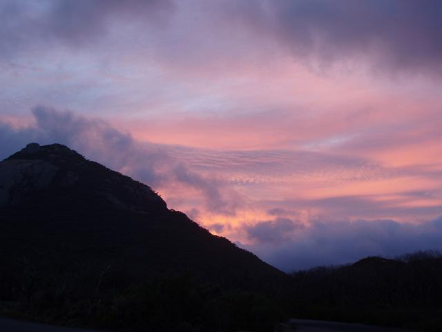 beautiful salmon pink sunset sky over wilsons prom from squeaky beach