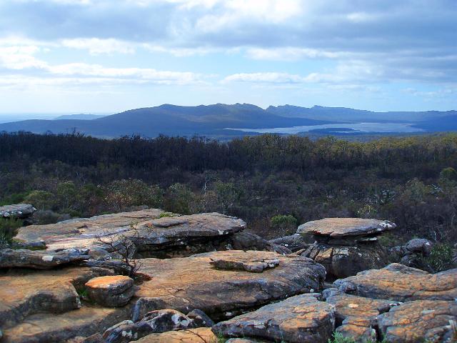 unusual rock formation and a rugged mountain range in the grampians mountains national park