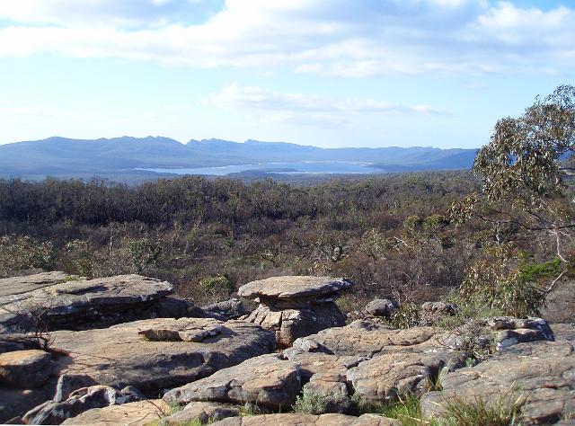 unusual rock pavement formation with a spectular mountain range backdrop, grampians mountains, victoria