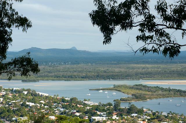 Landscape view of the Noosa hinterland looking across part of the town and the Noosa River estuary to a distant mountain range