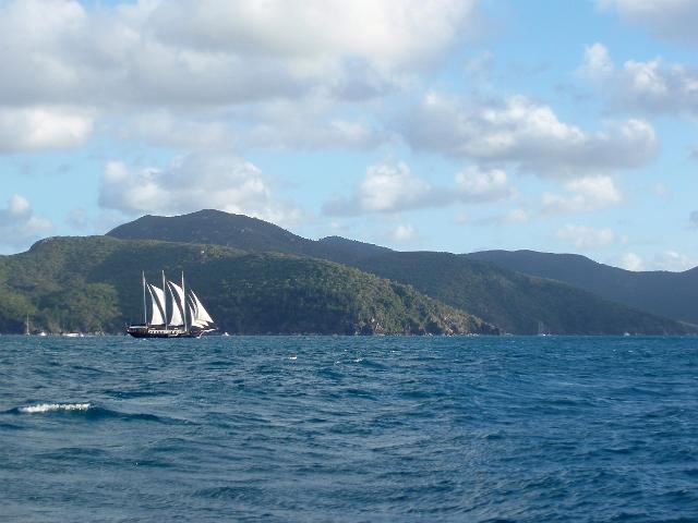 a square rigged sailing ship passing hook island in the whitsundays, north queensland