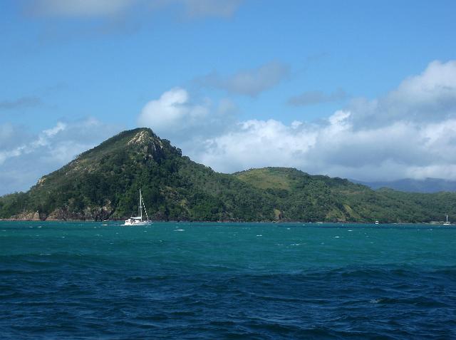 a yach sailing past south molle island in the whitsundays