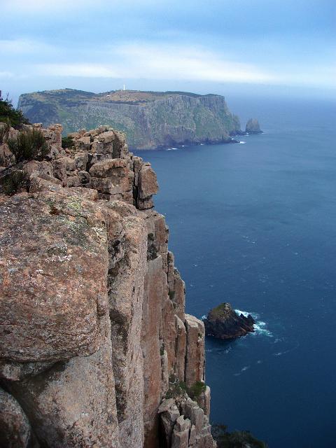 a view of tasman island and lighthouse viewed from the top of cliffs on cape pillar